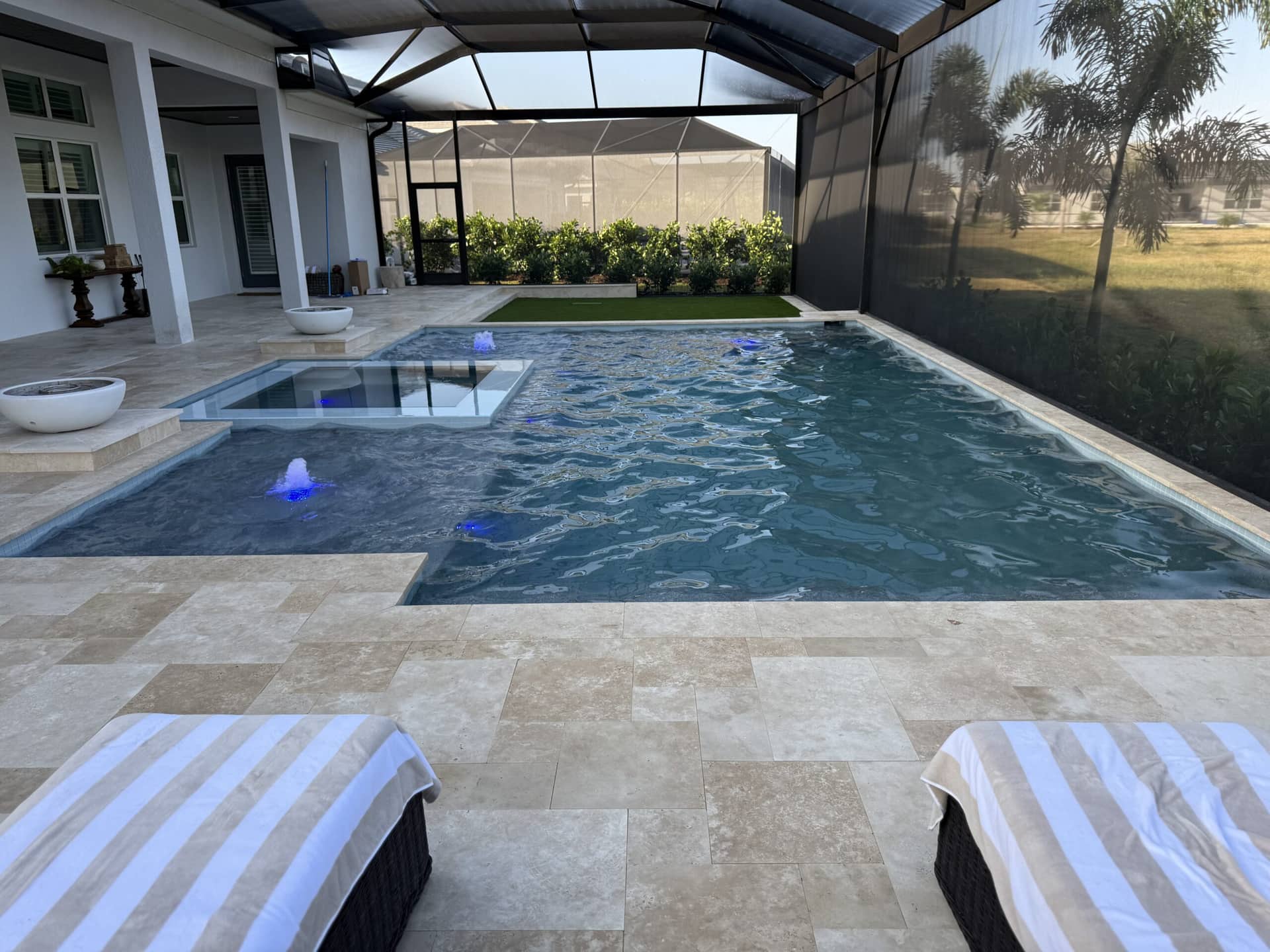 Compact freeform pool integrated into a Villages lanai